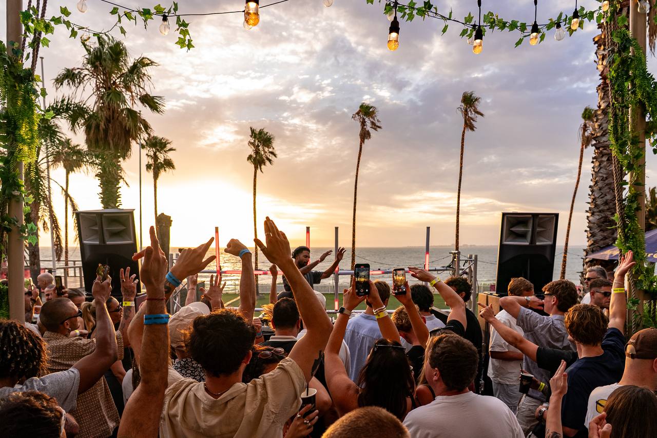 Riviera Beach Club — crowd hands up